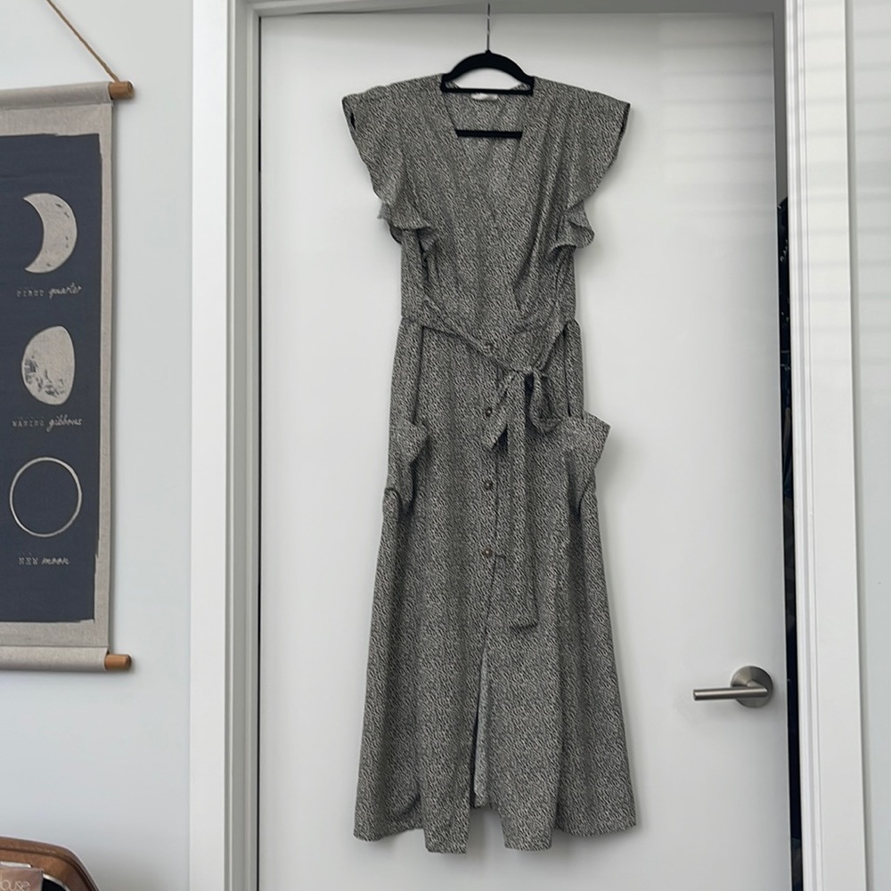 Cute black and white Dalmatian print dress with buttons up the front.